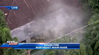 Fire crews battle flames that erupted at NE Miami-Dade home