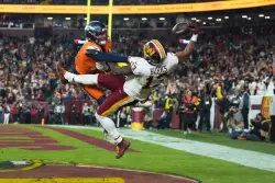 Catch of the year? Commanders’ Treylon Burks makes incredible 1-handed TD grab vs. Broncos