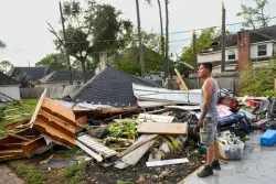 Torn roofs and smashed windows among damage to over 100 homes in a tornado near Houston
