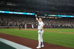 Mariners win AL West for 1st time in 24 years as Raleigh reaches 60 homers in 9-2 win over Rockies