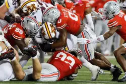 The Latest: Penn State and Texas drop out of the AP Top 25 as Miami reclaims its No. 2 spot