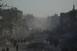 Palestinians return to ruins as aid groups push to scale up deliveries and US troops land in Israel