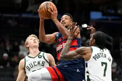 McCollum and Middleton lead the Wizards to a 129-126 win over Milwaukee despite Porter’s 30 points